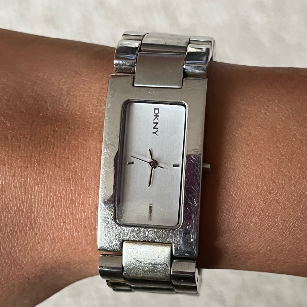 Silver used DKNY watch. Good condition.